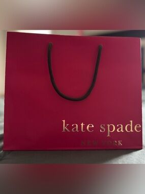 4x kate spade Hot Pink shopping bag  with silver logo and brown handles.